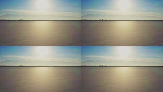 航拍阳光下结冰的湖面高清在线视频素材下载