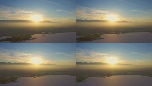 航拍阳光下结冰的湖面高清在线视频素材下载