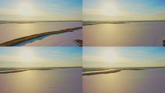 航拍阳光下结冰的湖面高清在线视频素材下载