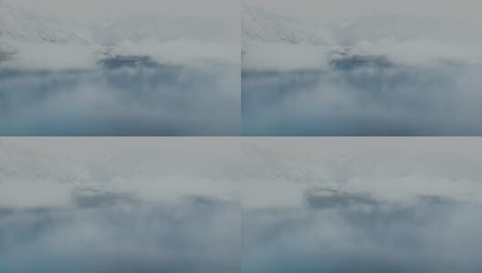航拍雪后的西藏林芝巴松措云雾缭绕高清在线视频素材下载