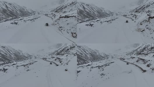 丙察察冰雪行驶的越野车高清在线视频素材下载