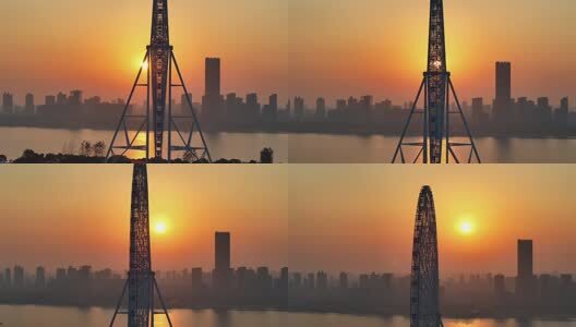 航拍日出朝阳下的摩天轮高清在线视频素材下载