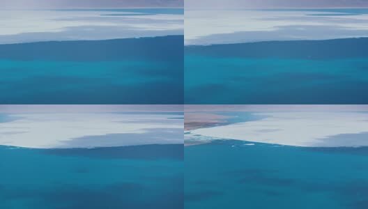 航拍新藏线上龙木错结冰的湖面高清在线视频素材下载