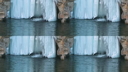 冬季湖面瀑布结冰与泉水高清在线视频素材下载