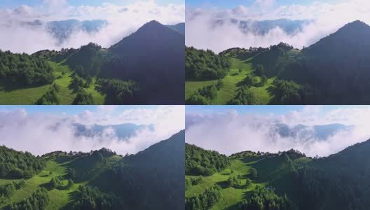 航拍云雾缭绕的高山草原高清在线视频素材下载