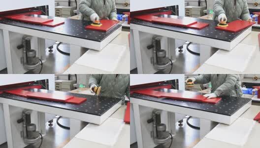 工人用机器打磨红色板材的工作场景高清在线视频素材下载