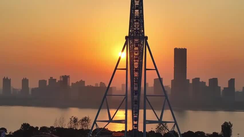 航拍日出朝阳下的摩天轮