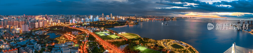 航拍中国海南省海口市傍晚的海口湾灯光秀全景